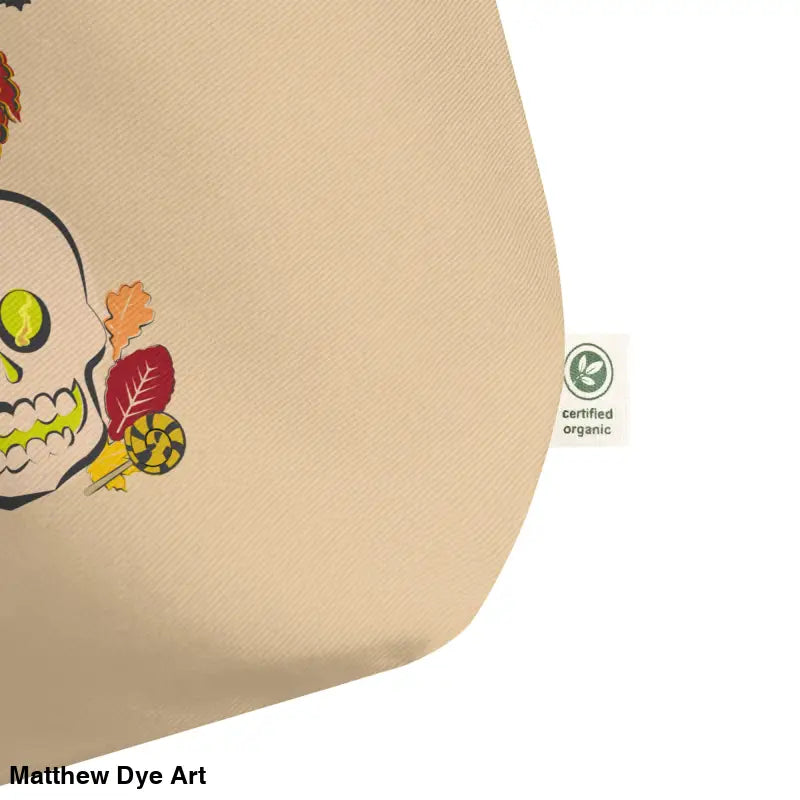 Beige tote bag featuring skull and leaf design for Halloween enchantment