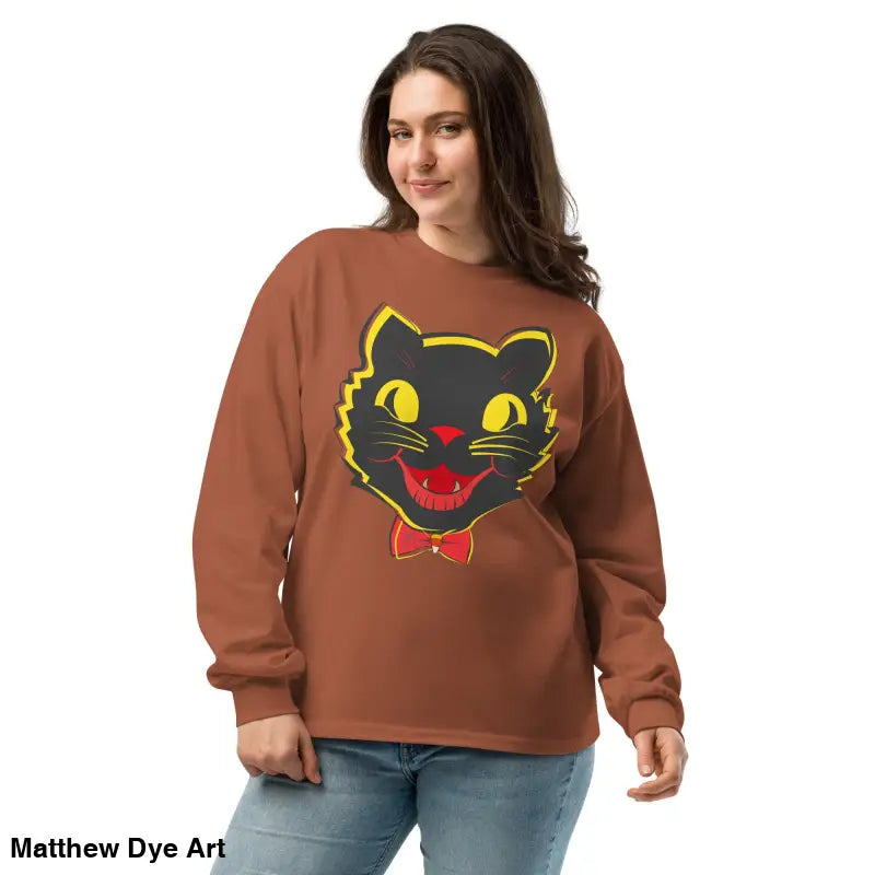Woman in a brown sweatshirt featuring a vintage cat graphic from a premium heavyweight long sleeve