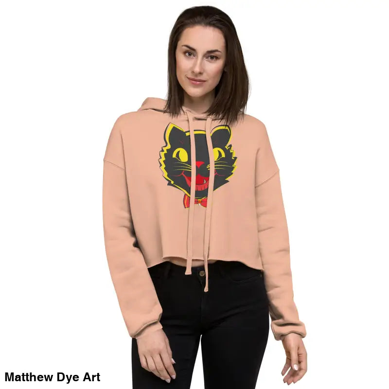 Woman in a stylish vintage black cat crop hoodie featuring a whimsical graphic