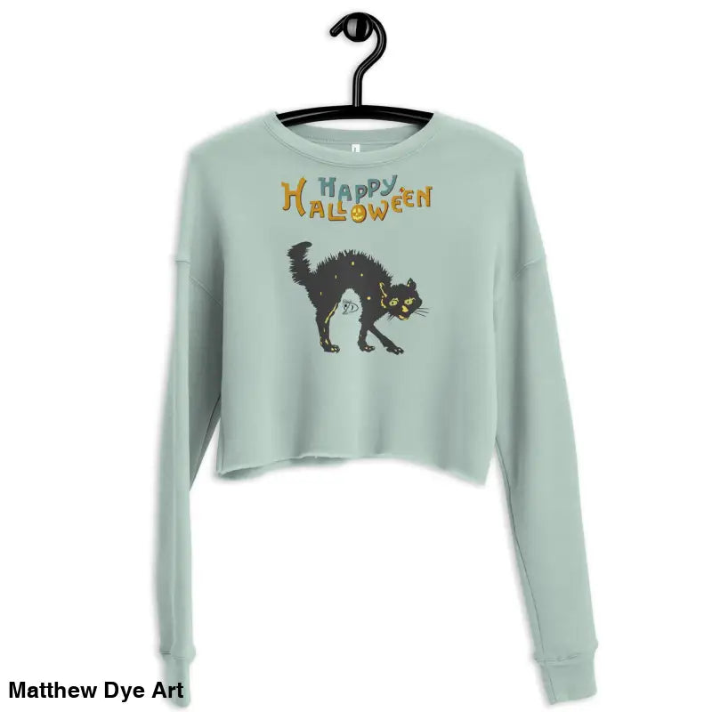 Light green cropped sweatshirt featuring a scary cat Halloween design and text
