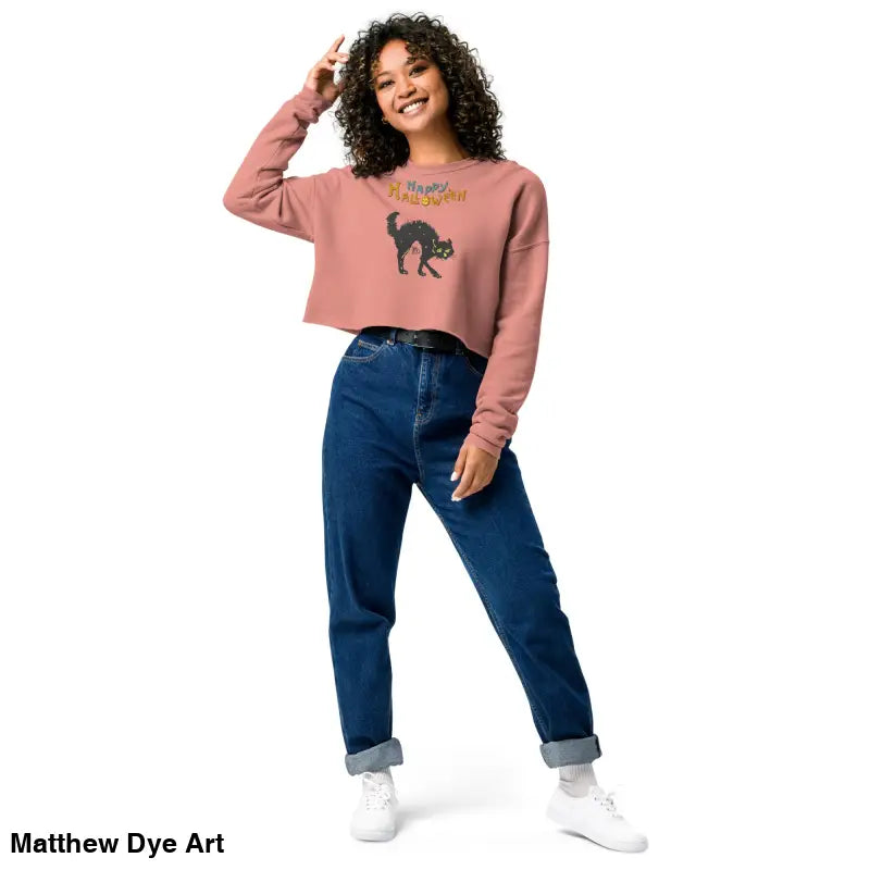 Woman in a cropped sweatshirt and jeans featuring the Scary Cat Halloween design