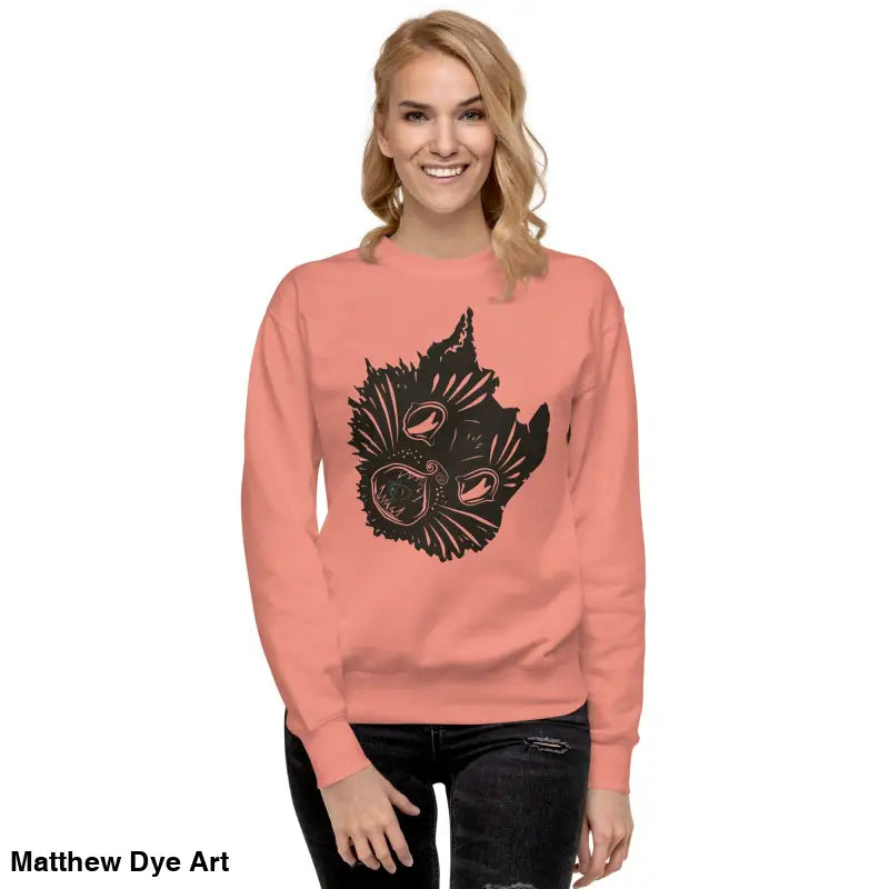 Salmon-colored premium spooky sweatshirt featuring a black cat face design