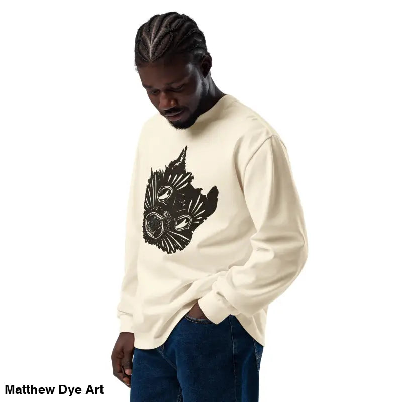 Man in cream long-sleeve shirt featuring black graphic on Ah Kitty Halloween sweatshirt