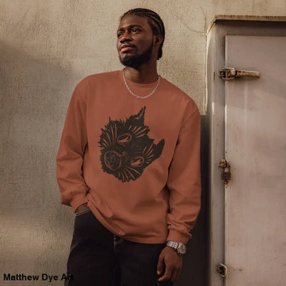 Man in a long-sleeved sweatshirt featuring a cat graphic for Halloween, Ah Kitty design