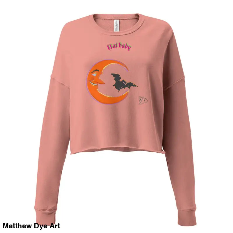 Pink cropped sweatshirt featuring moon and bat graphic for spooky fall fashion