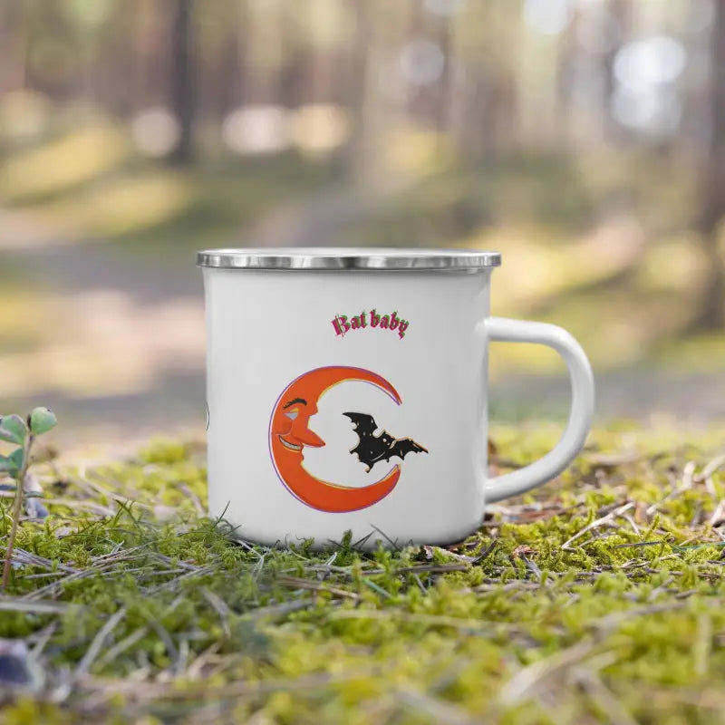 White enamel camping mug featuring a witch silhouette against an orange crescent moon design