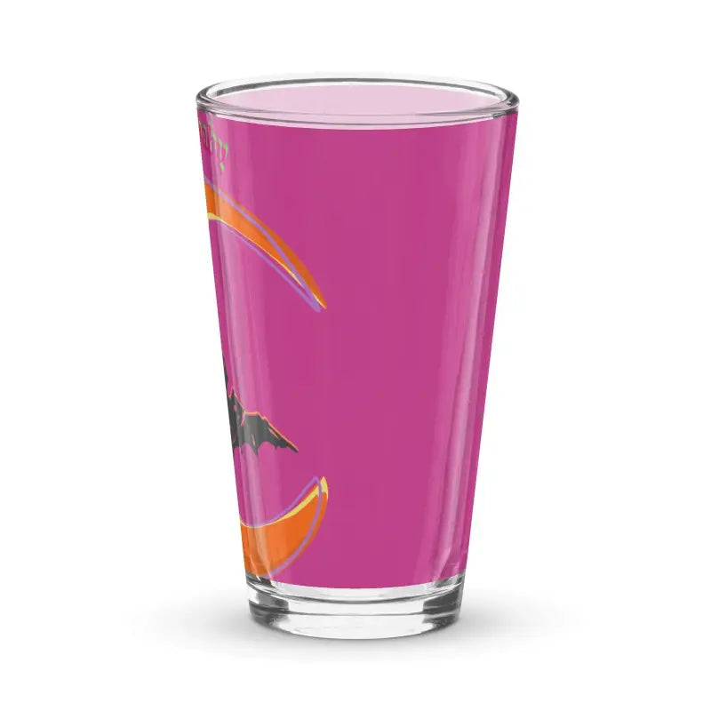 Clear Bat Baby Pint Glass filled with pink liquid and adorned with orange designs