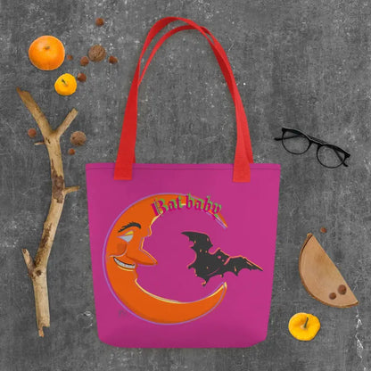 Pink tote bag featuring a smiling crescent moon and bat design for Halloween trick or treat