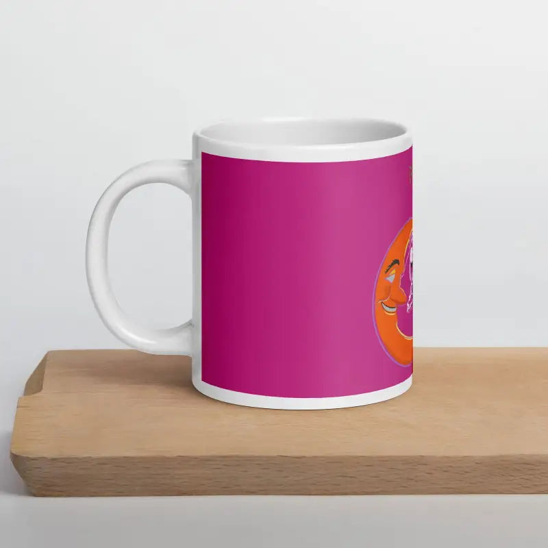 White glossy mug with bat baby design against a pink background, perfect for Halloween