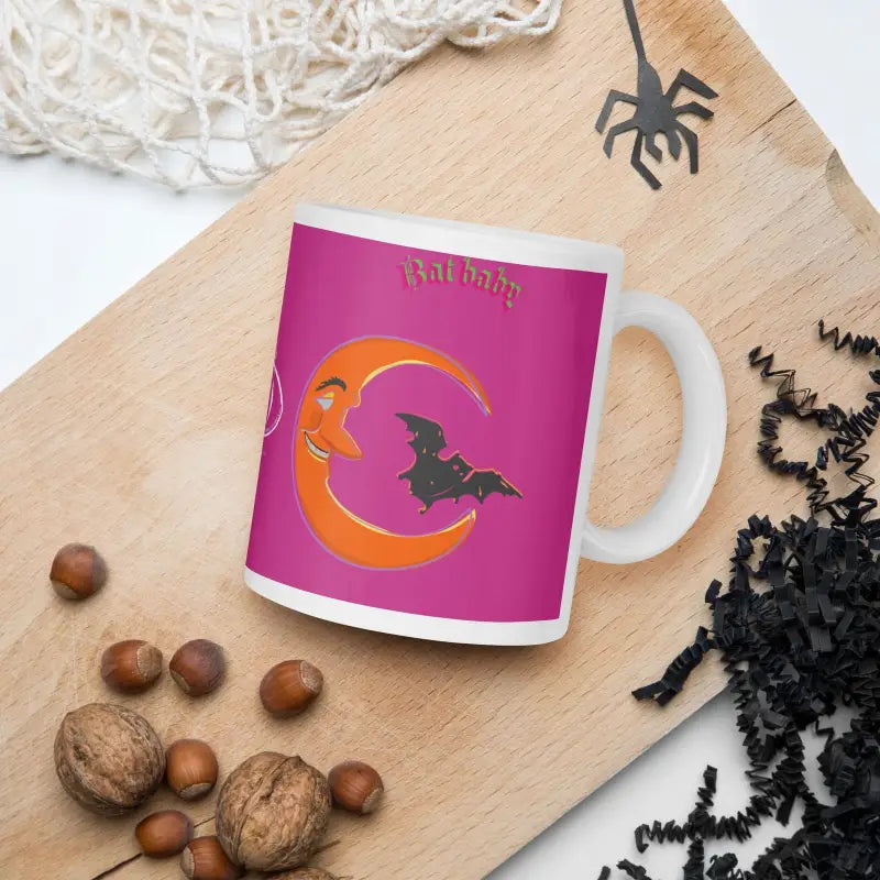 White glossy mug with Halloween bat baby design on pink background