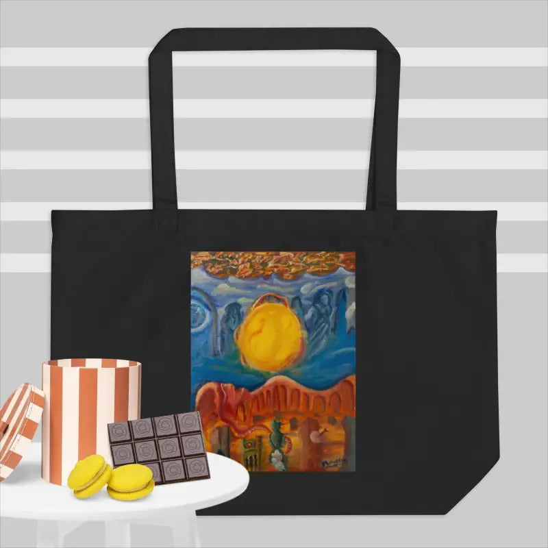 Black organic cotton tote bag with vibrant artistic desert landscape and sun illustration