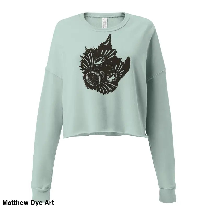 Light blue cropped sweatshirt featuring black graphic of surreal cat design for spooky season style