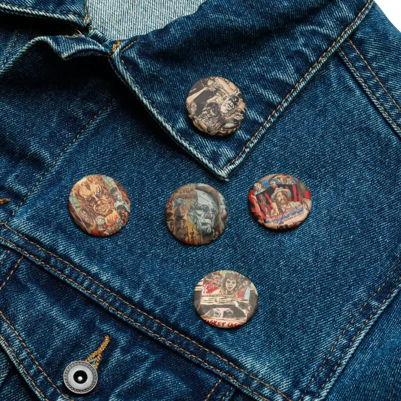 Vintage-looking horror enamel pins displayed on denim fabric for Scream Worthy Pins collection