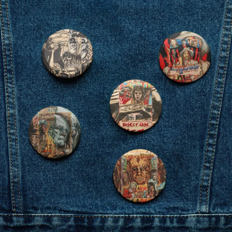 Collection of Cult Classic Horror Enamel Pins on Denim Fabric Displaying Vintage Style