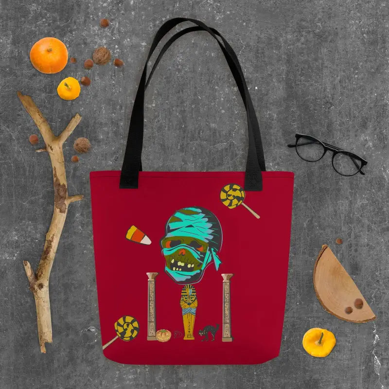 Red reusable trick or treat tote bag with a quirky Halloween mummy character design