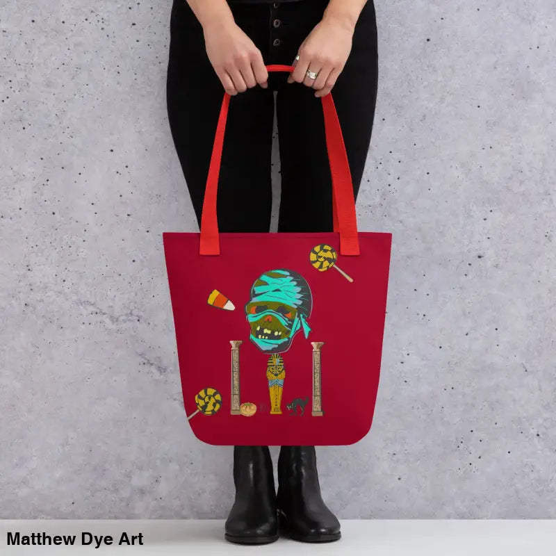 Red Halloween-themed CURSE OF THE PHARAOH reusable trick or treat tote bag featuring a mummy design