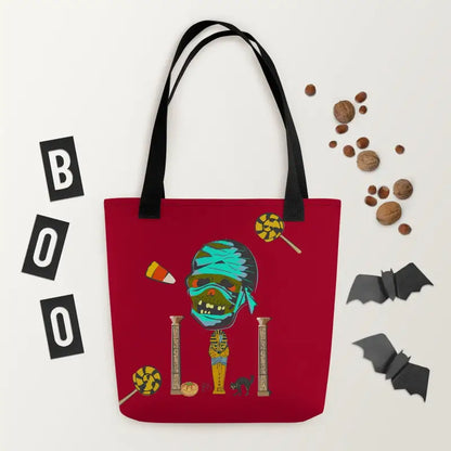 Red reusable trick or treat tote bag featuring Halloween mummy character with candy decor