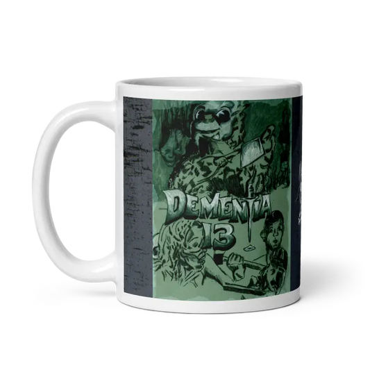 White ceramic mug with Dementia 13 artwork by Matthew Dye, epitomizing ghoulishly chic style