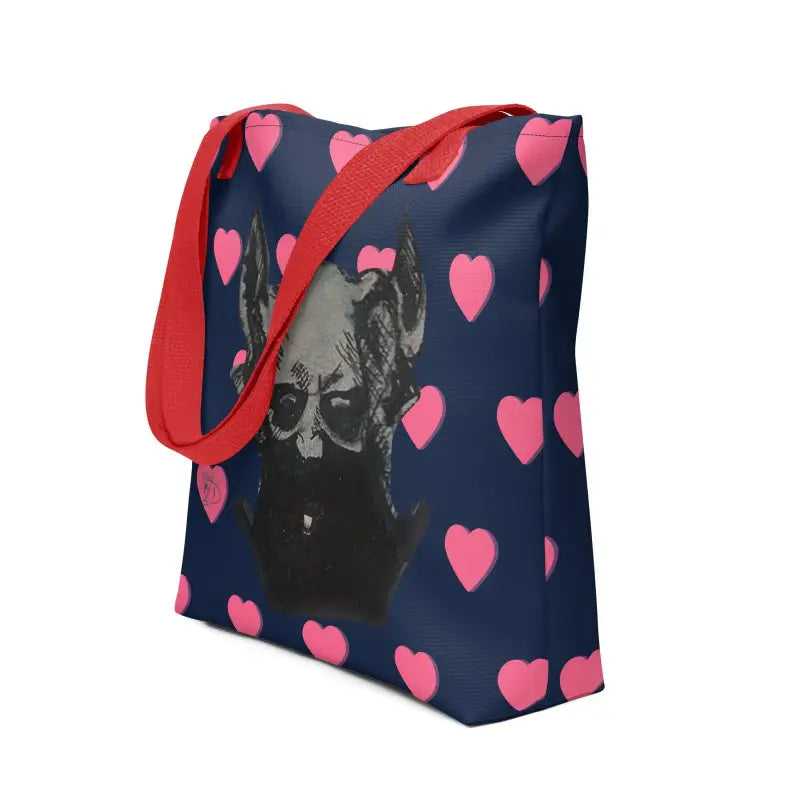 Navy blue tote bag with pink hearts and demonic figure sketch, featuring red straps