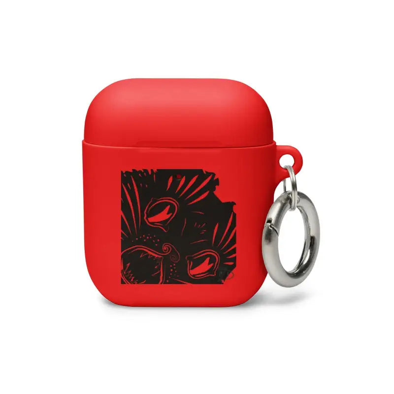 Red AirPods case with black graphic design and silver keyring, featuring kitty head rubber design