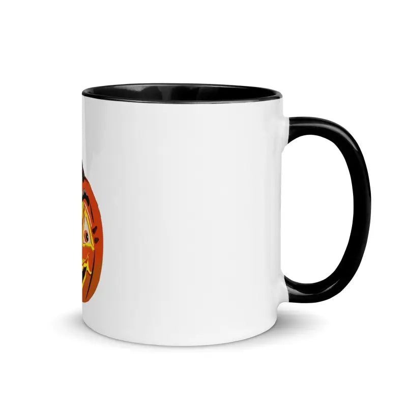 White ceramic Pumpkin Witch Mug with black interior, handle, and orange circular design