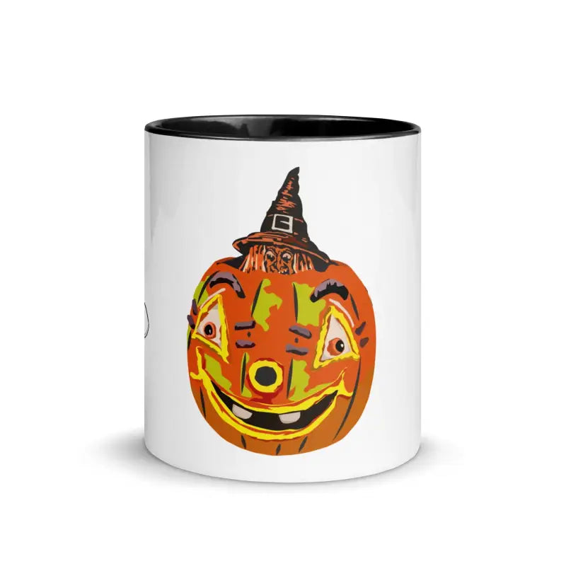 White ceramic pumpkin witch mug with vintage Halloween design featuring a witch hat