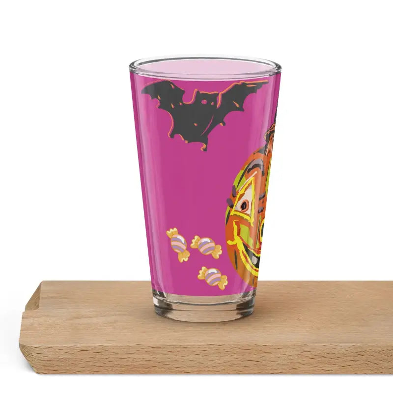 Halloween-themed shaker pint glass featuring jack-o’-lantern and bat designs on pink background