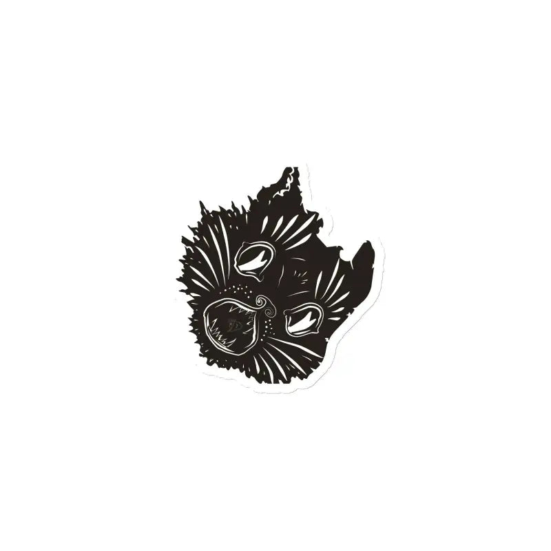 Black silhouette of a kitty head magnet with spiky fur and bright eyes