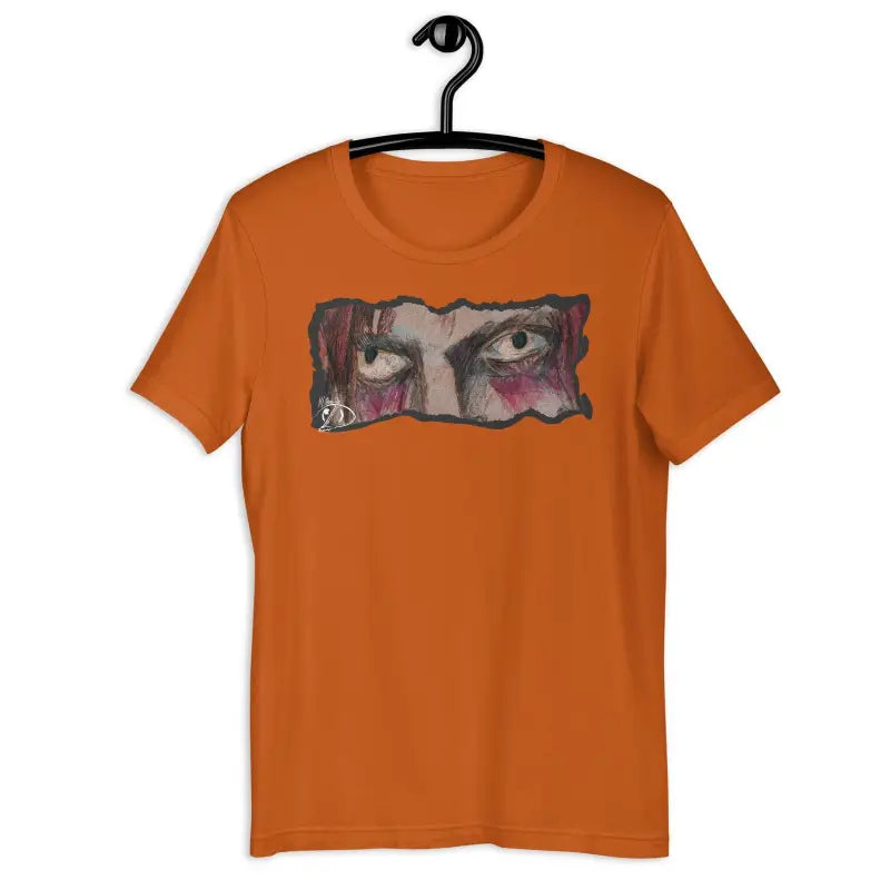 Orange t-shirt featuring haunting eyes graphic, perfect for Halloween spirit