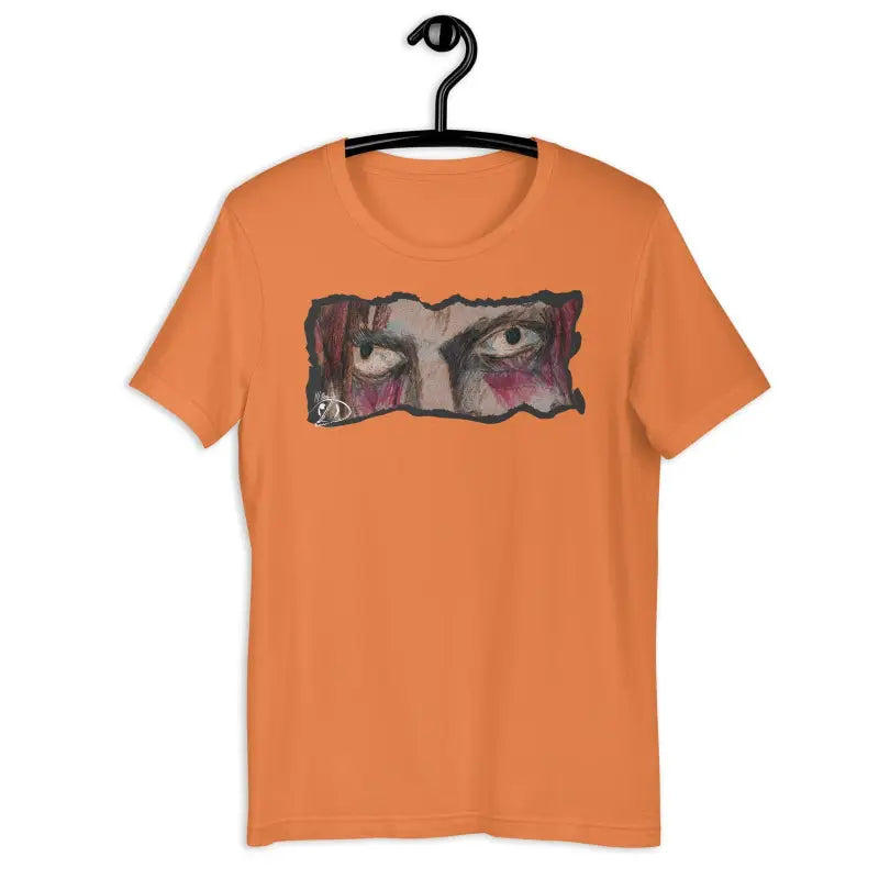 Orange t-shirt featuring haunting eyes design for Halloween spirit and eerie elegance