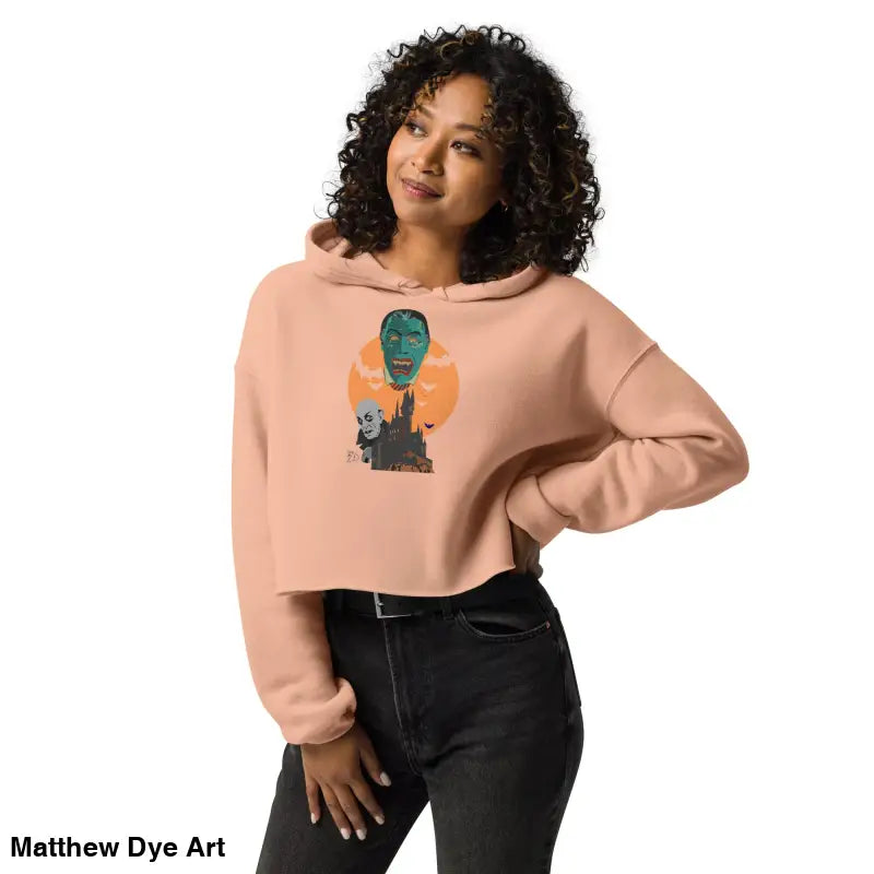 Peach-colored cropped hoodie from Fangs & Fashion featuring Matthew Dye art, meticulously crafted