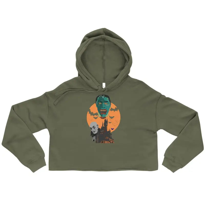 Olive green cropped hoodie featuring Matthew Dye art of zombies and bats against an orange moon