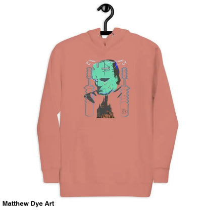 Salmon-colored hoodie featuring a Frankenstein graphic, a delightful tribute to timeless lore