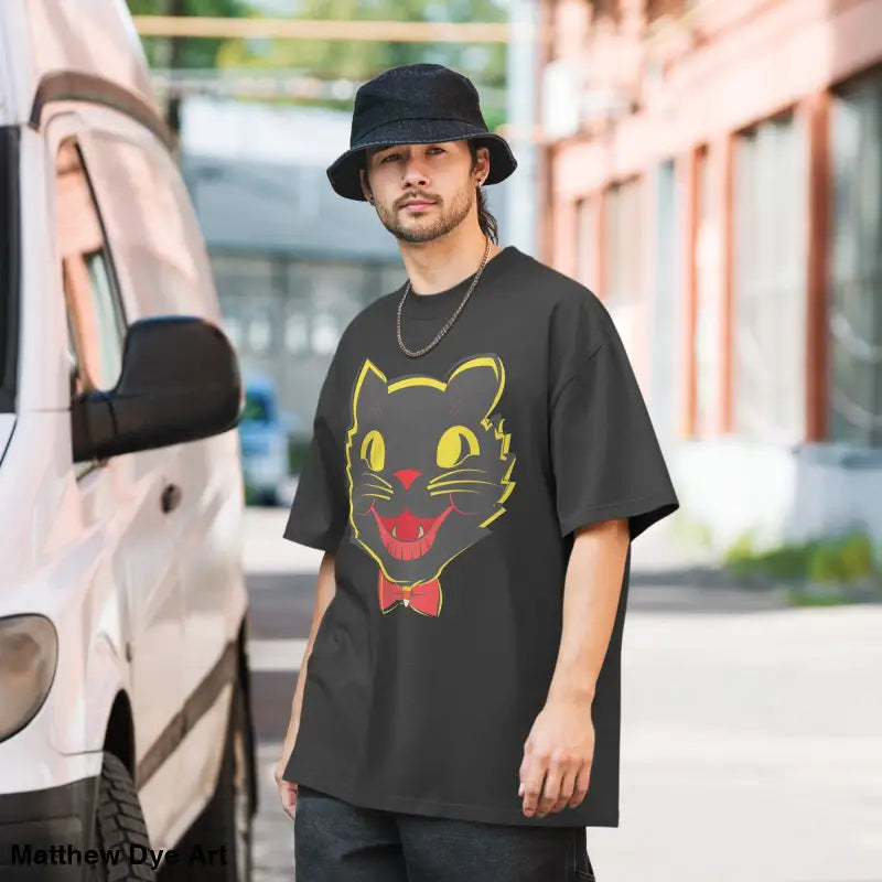 Black oversized faded t-shirt featuring a vintage cat graphic for Halloween style