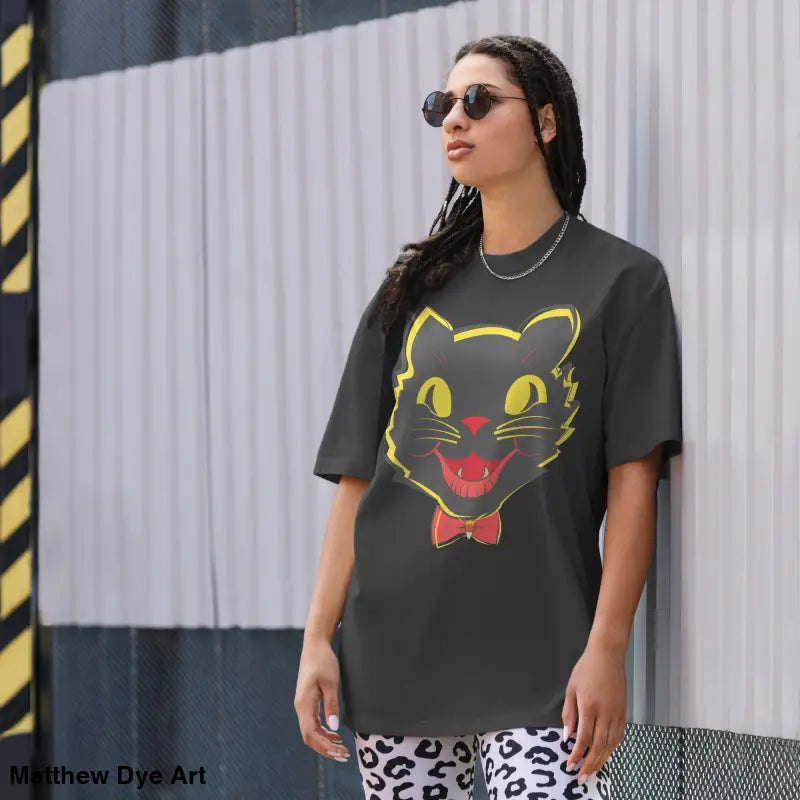 Black oversized faded t-shirt featuring a vintage cat graphic for Halloween celebration