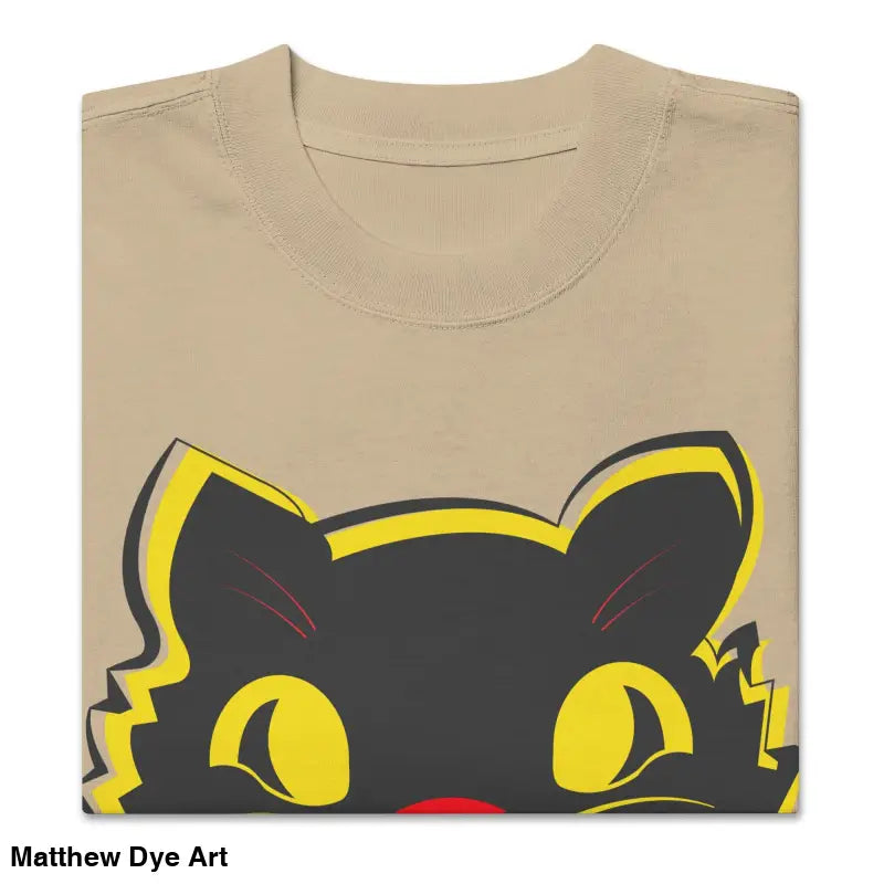 Folded vintage cat oversized faded t-shirt featuring a whimsical cat graphic