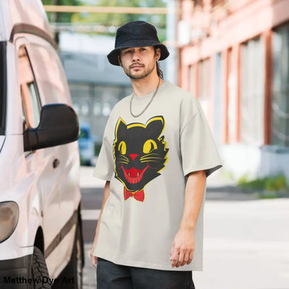 Man models a Grinning Ghoul vintage cat oversized faded t-shirt with a playful design