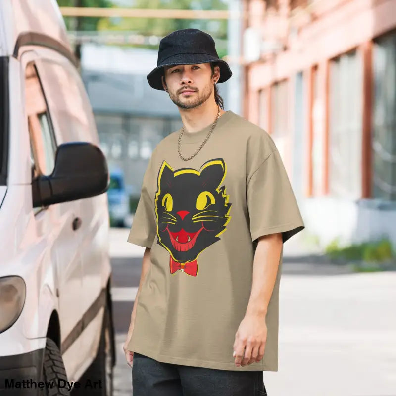 Mens vintage cat oversized faded t-shirt featuring a black cat graphic on tan background