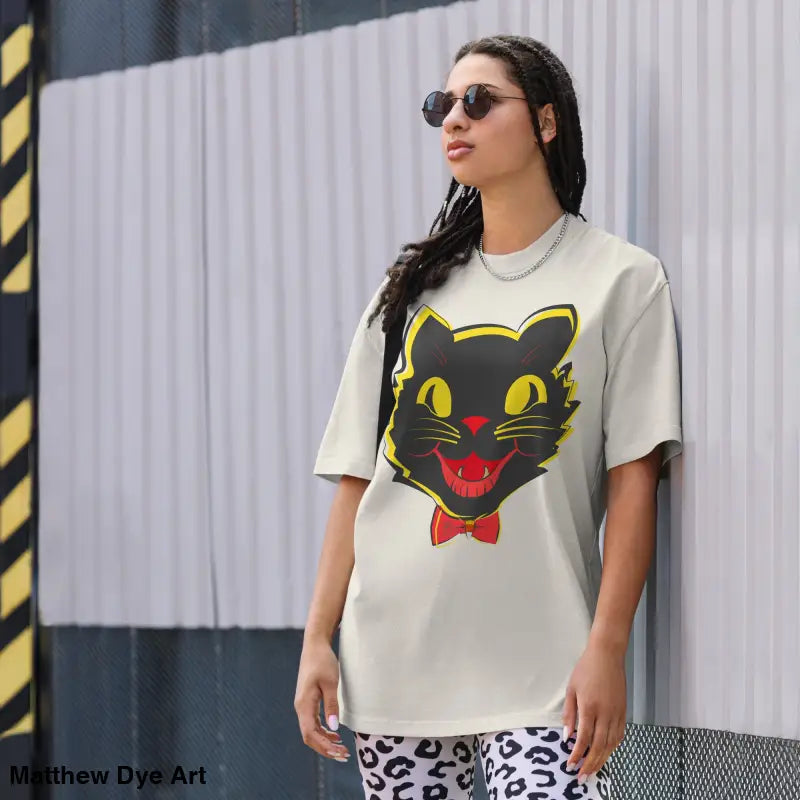 Oversized faded t-shirt featuring a black cat graphic from Grinning Ghoul vintage collection
