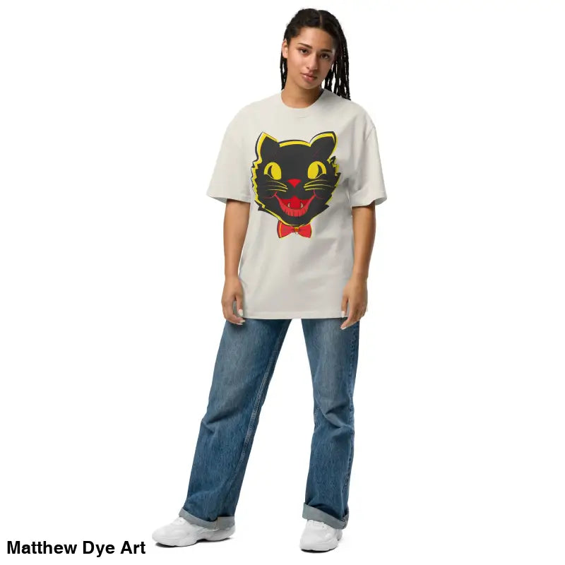 Woman wearing a vintage cat oversized t-shirt from Grinning Ghoul’s Halloween collection