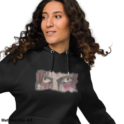 Black Haunted Gaze Unisex Eco Raglan Hoodie featuring an eye graphic for a unique style