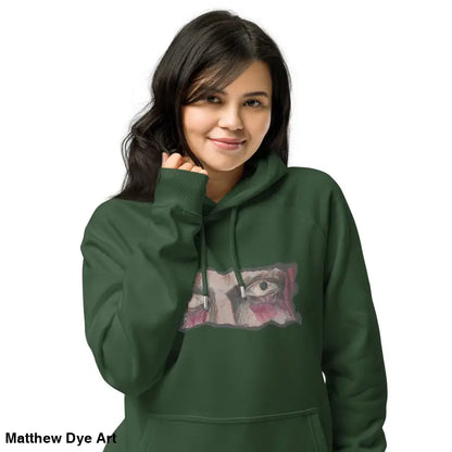 Green Haunted Gaze Unisex Eco Raglan Hoodie featuring an eye graphic for unique style