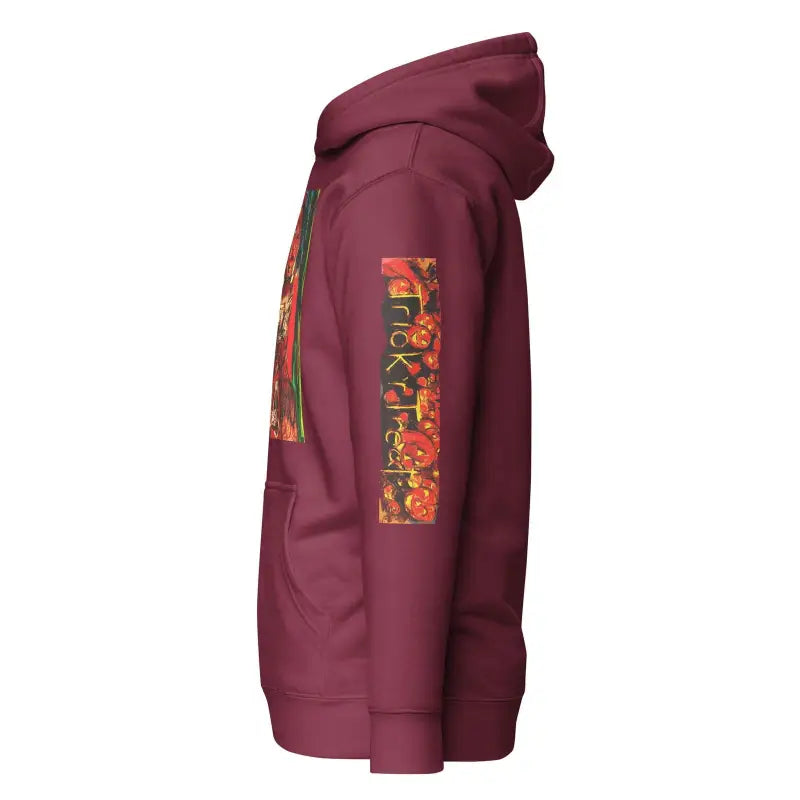 Burgundy unisex hoodie featuring colorful graphic text on sleeve for Trick ’r Treat