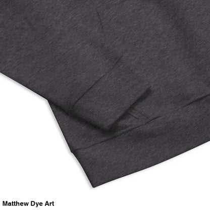 Gray hooded sweatshirt sleeve featuring glowing green eyes design from Howl at the Moon hoodie
