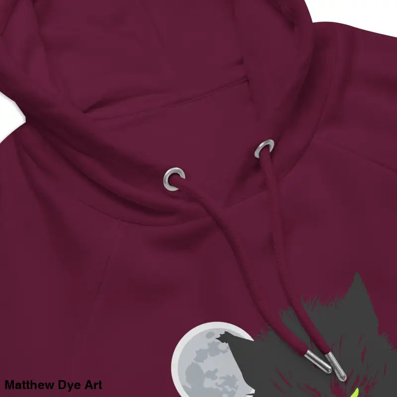 Maroon raglan hoodie featuring a wolf design with glowing green eyes for eco-friendly style