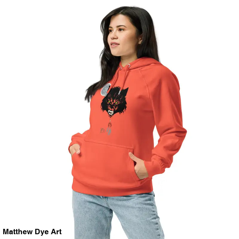 Orange hoodie featuring wolf graphic with glowing green eyes in eco-friendly design