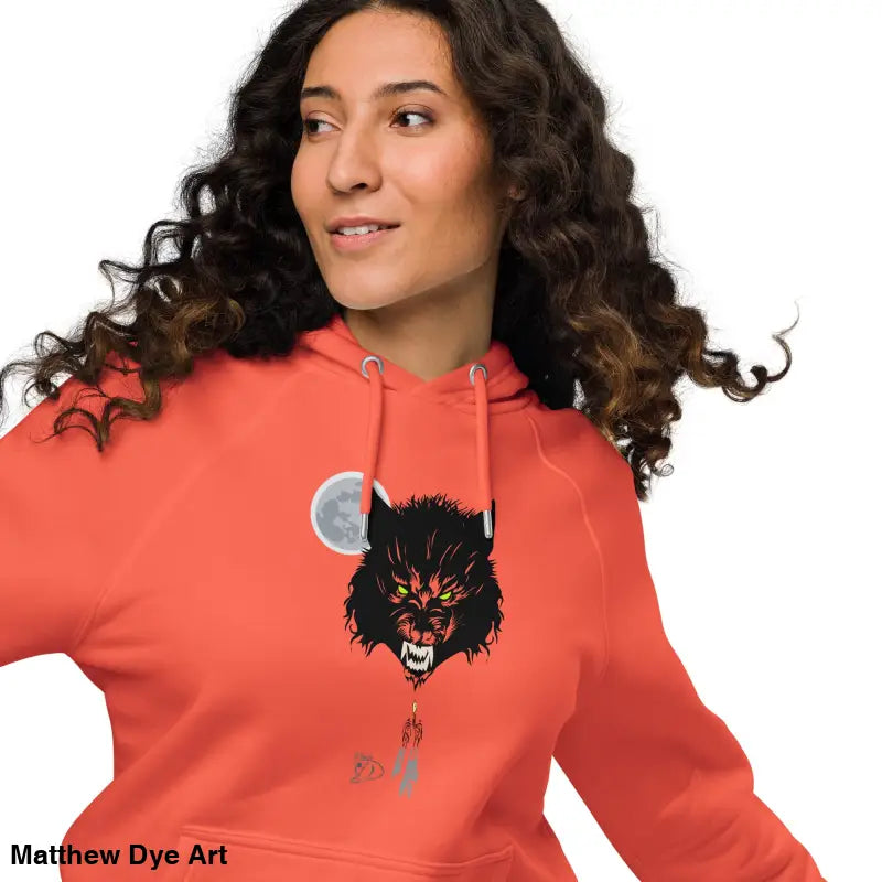 Coral raglan hoodie featuring a werewolf graphic with glowing green eyes
