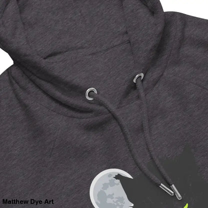 Gray hooded sweatshirt featuring glowing green eyes in Howl at the Moon design