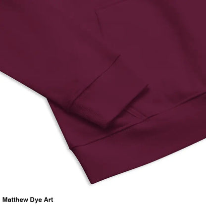 Burgundy raglan hoodie showcasing candlelit hands and glowing green eyes details
