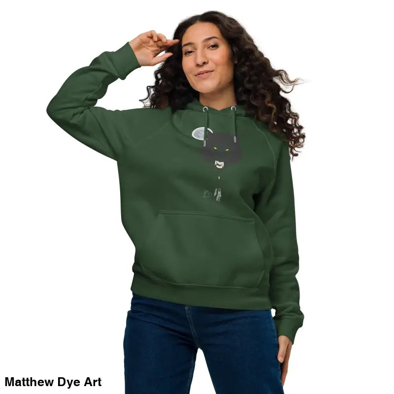 Green hoodie featuring glowing green eyes graphic from Howl at the Moon collection
